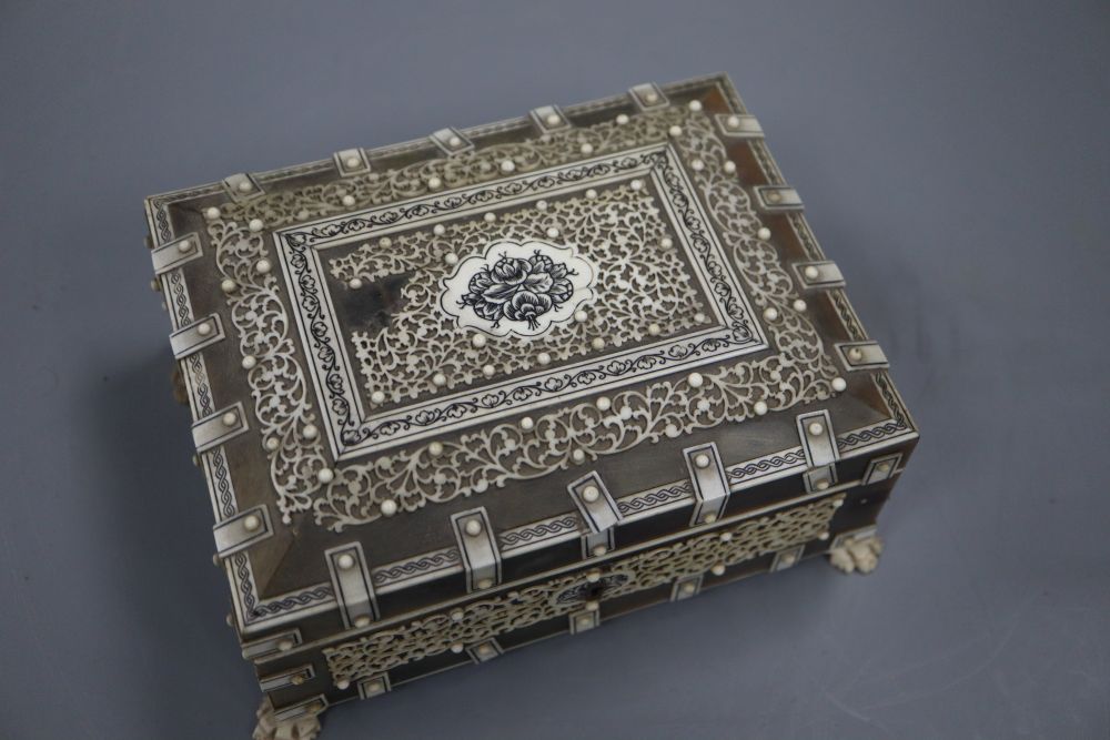 A 19th century Southern Indian horn and ivory mounted trinket box, height 7.5cm and a similar card case